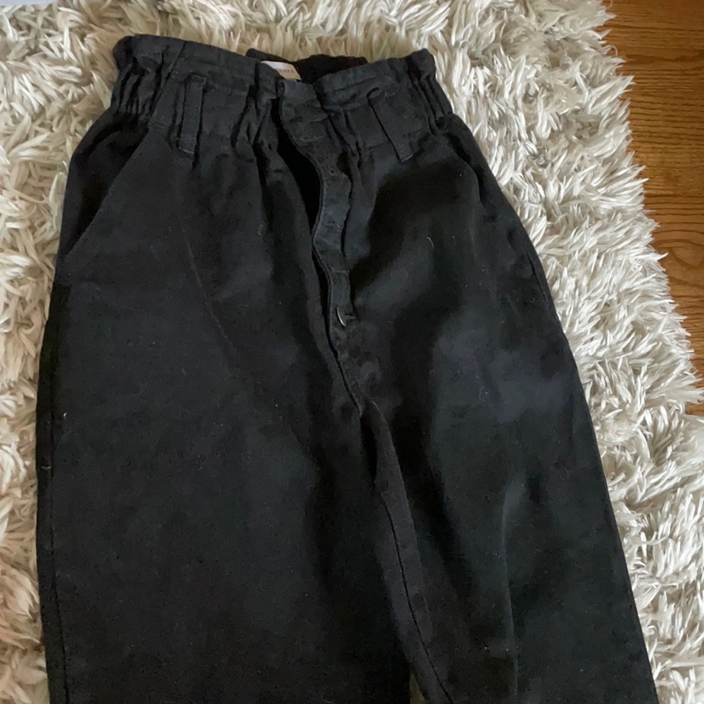 Black jeans with drawn in waste